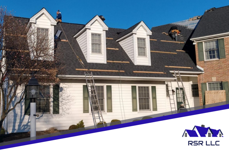 Elkhorn roof repair expert removes decaying wood from leaking roof.